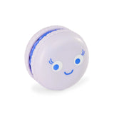 Lilac purple kawaii macaron fidget toy with a happy blue eyed face