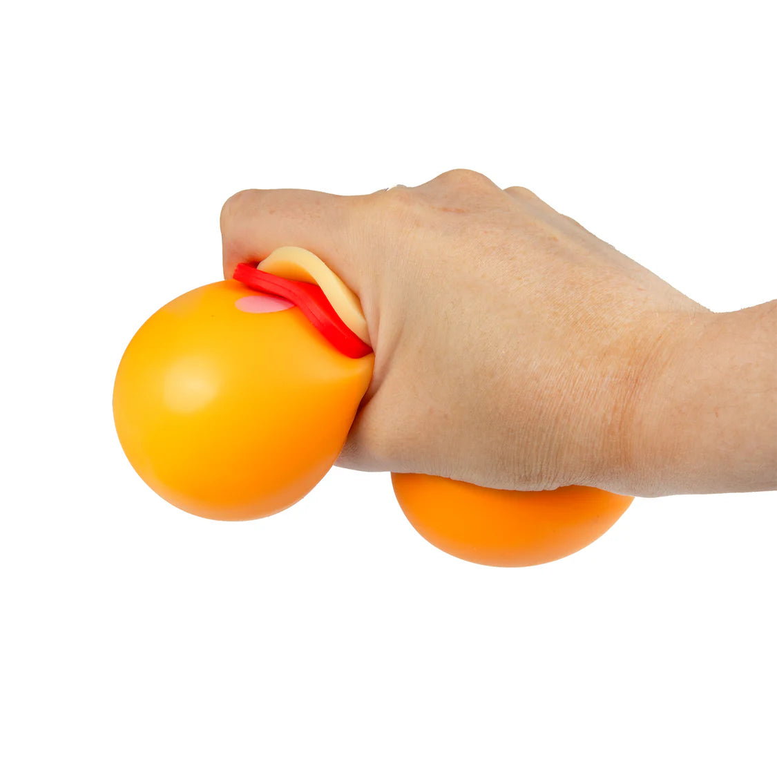 Orange fidget pizza base being squeezed in hand, soft squishy sensory stress toy