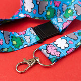 blue lanyard with green frogs and colourful clouds pattern with metal clasp