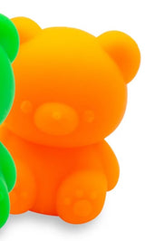 Close-up texture detail of a neon orange fruity squish bear