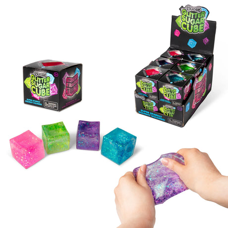 All four glitter sugar cubes displayed alongside retail box, display case and hands stretching a purple cube