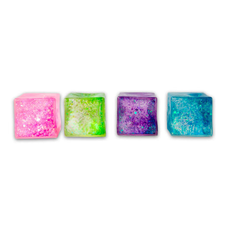 All four Scrunchems Glitter Sugar Cubes displayed in a row — pink, green, purple and blue