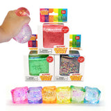 Glittery Chilly Cube toy set with packaging and a hand holding a cube.