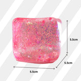 Pink glittery square object with dimensions labeled on a white background