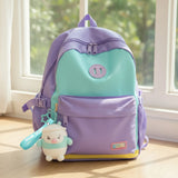 Bubble tea Gum Gums keychain plush with teal strap hanging on a purple backpack