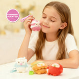 Child holding a pink strawberry milk Gum Gums keychain plush, a scented kawaii bag charm