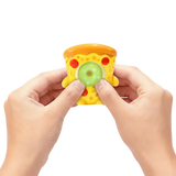 Hands squeezing a pizza Gum Gums mini figure as it blows a green bubble