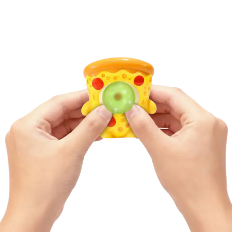 Hands squeezing a pizza Gum Gums mini figure as it blows a green bubble