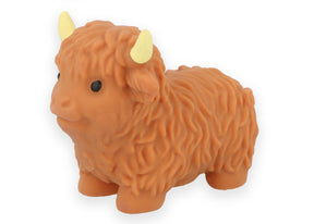 Orange-brown highland cow stretchy squishy squeeze toy with shaggy coat and yellow horns