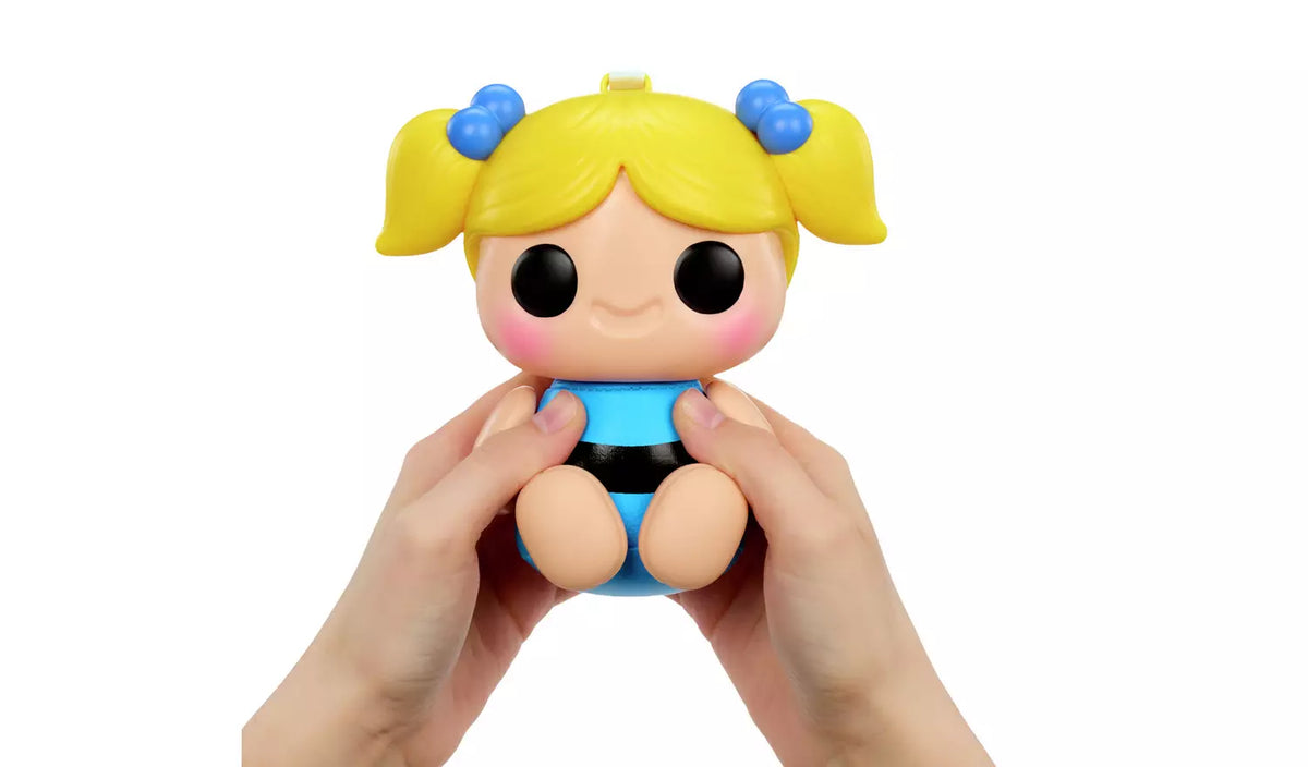 Hands squeezing Hyojo Bubbles squishy collectible with blonde pigtails and blue striped outfit