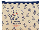Incognito Pretty Anxious zip pouch with illustrated tulip character and delicate floral pattern on a cream background with navy zip