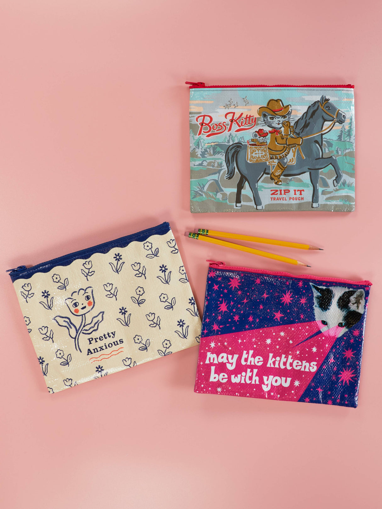 Pretty Anxious zip pouch shown alongside other Incognito zip pouch designs on a pink background