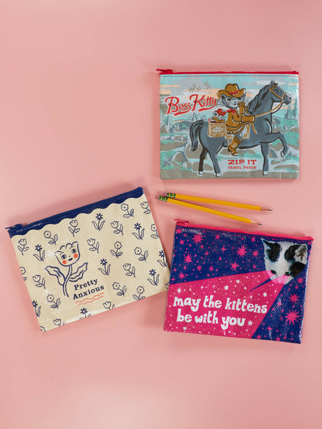 Pretty Anxious zip pouch shown alongside other Incognito zip pouch designs on a pink background