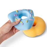 Blue jumbo donut squishy being stretched and deformed in one hand to show flexibility