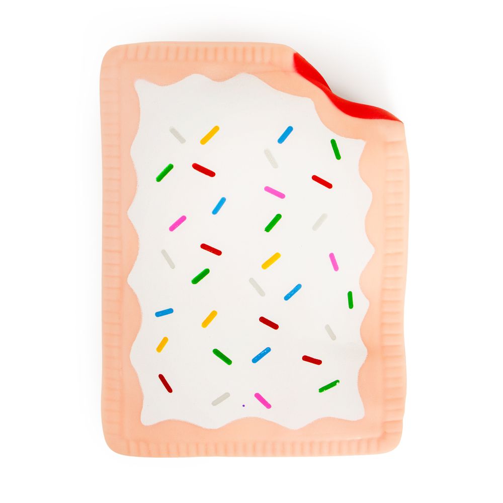 Flat lay of a jumbo peach pink squishy Pop-Tart with white icing drizzle and colourful sprinkles
