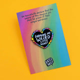 Katie Abey Following My Weird Little Heart soft enamel pin on rainbow backing card, angled