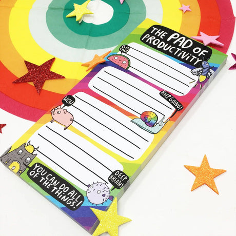 Katie Abey Pad of Productivity rainbow notepad, angled view, glitter star props
