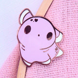 Kawaii purple axolotl hard enamel pin on pink fabric background