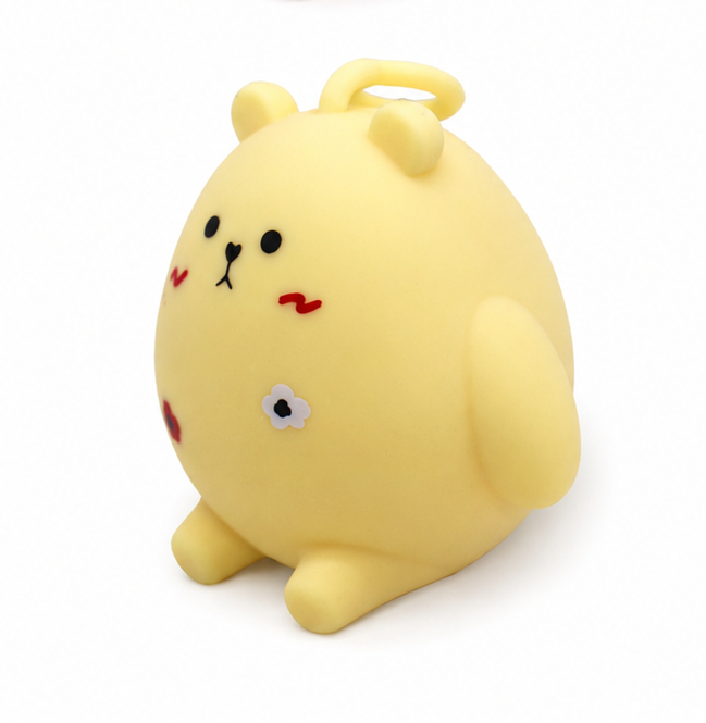 Yellow kawaii bear squishy toy with flower detail, stress relief fidget toy
