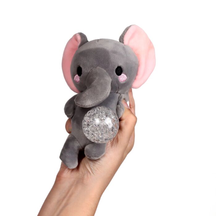 Kawaii elephant gel bead belly squeeze plush toy being held in a hand with the clear gel bead belly pushed out, showing the grey body with pink inner ears