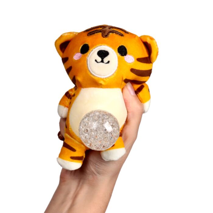 Kawaii tiger gel bead belly squeeze plush toy being held in a hand with the clear gel bead belly pushed out, showing the textured bead fill through the transparent window