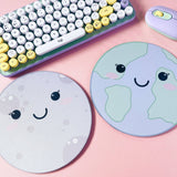 Kawaii moon and earth mouse pads side by side, grey and green, cute desk accessories