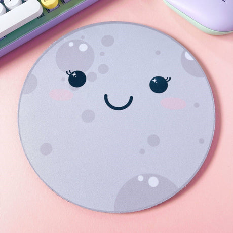 Kawaii moon mouse pad angled view showing rubber base, grey round desk pad