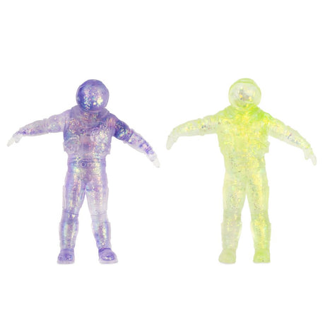 Purple and green glittery translucent stretchy spaceman fidget toys side by side, both standing upright