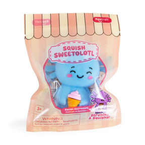 A packaged Keycraft 'Squish Sweetolot' squishy toy in a pink and peach stand-up pouch with a clear window showing the blue character holding an ice cream cone.