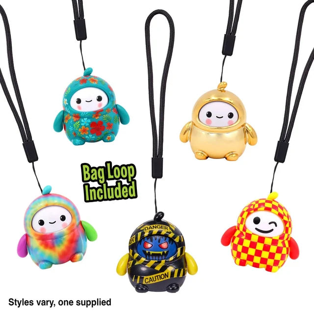 Five LamaTama Series 1 characters on black lanyards including floral, gold and tie-dye designs