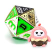 Pink and brown dessert-themed LamaTama Series 1 character with heart eyes beside green dice box