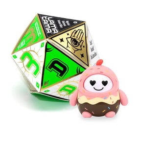 Pink and brown dessert-themed LamaTama Series 1 character with heart eyes beside green dice box