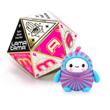 Blue and pink swirl LamaTama fortune teller figure standing beside its pink dice box