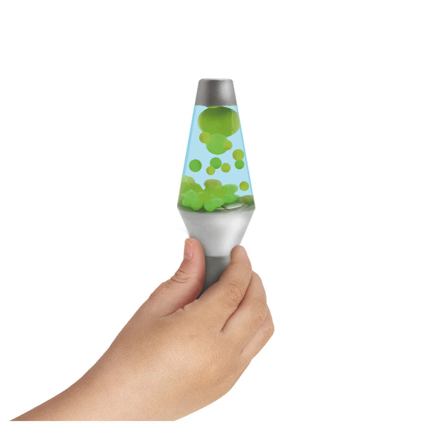 Hand holding Lava Brand Squish N Flow showing green glow-in-the-dark globs in blue liquid