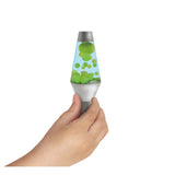 Hand holding Lava Brand Squish N Flow showing green glow-in-the-dark globs in blue liquid