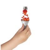 Hand holding Lava Brand Squish N Flow showing red and orange globs flowing upward when squeezed