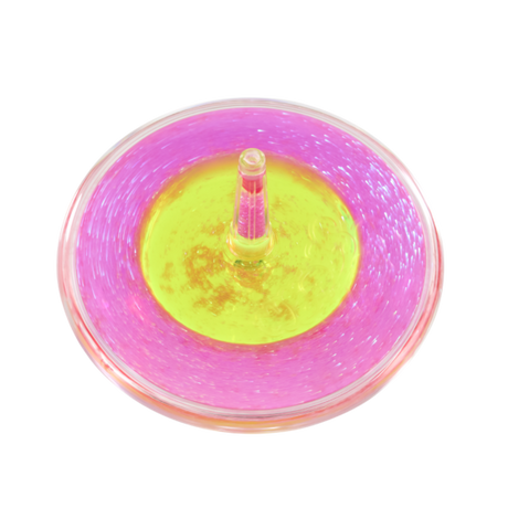 Close-up overhead view of pink and yellow Lava Storm liquid spinner in motion on black surface