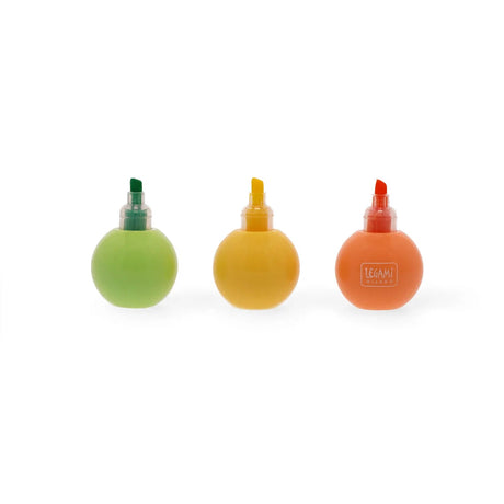 Three pastel coloured ball shaped highlighters in green, yellow and orange with visible chisel tips