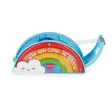Side view of Legami rainbow tape dispenser showing the tape roll loaded inside and the serrated cutting edge