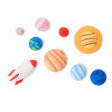 Nine Legami solar system erasers including all eight planets and a rocket shaped eraser arranged on a white background