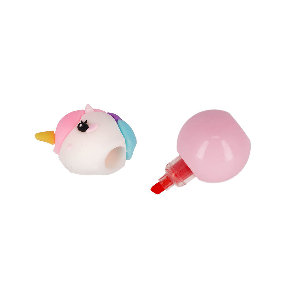 Pastel unicorn shaped cap beside a separate pink ball highlighter for the Legami 3-in-1 set