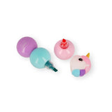 Four separated pieces of the Legami 3-in-1 unicorn highlighter set showing chisel tips in red, teal and purple