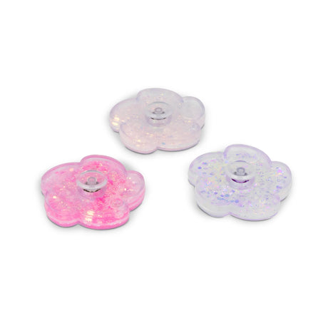 Three flower fidget spinners in pink, white, and lilac with liquid glitter