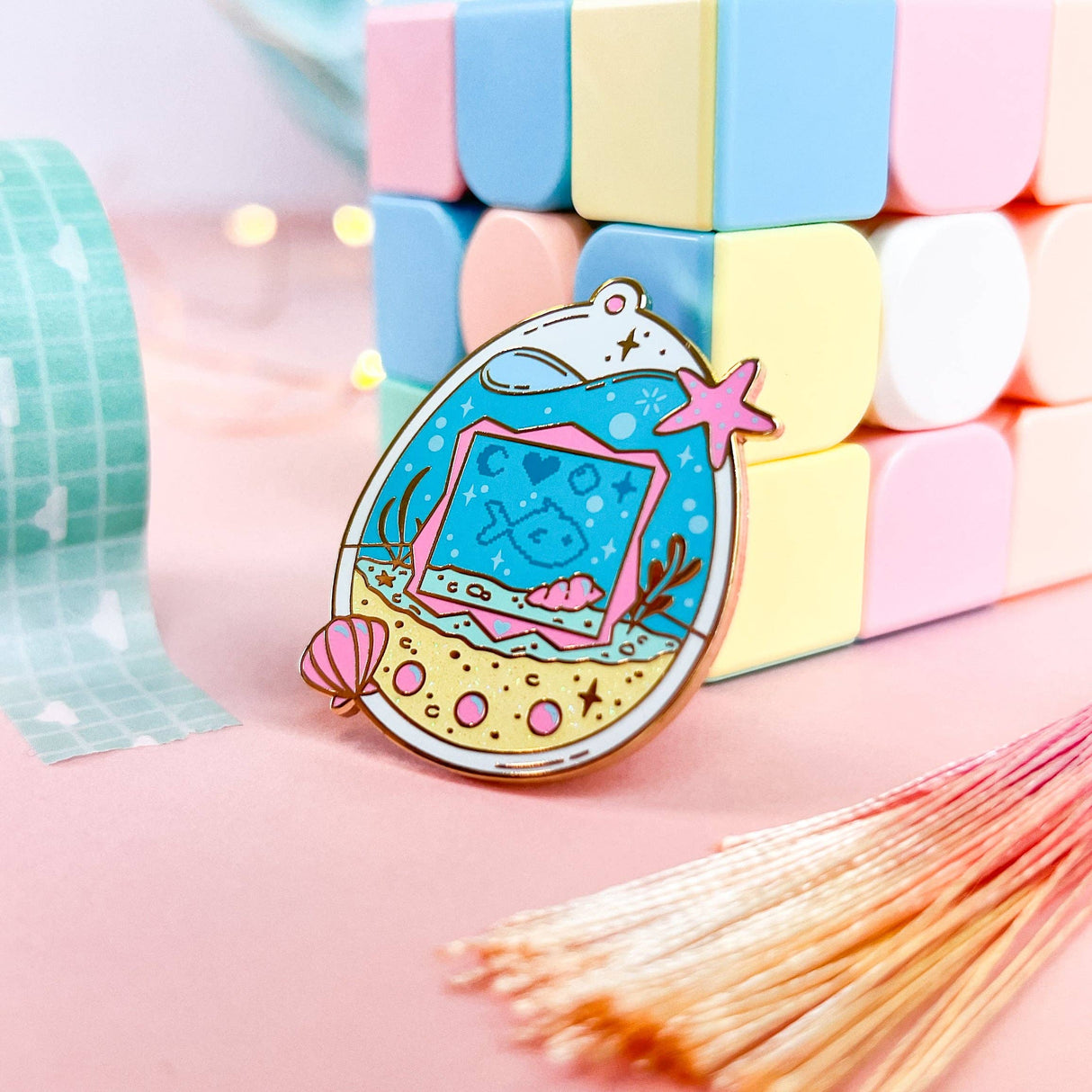 Lula Rocks Digital Aquarium enamel pin, blue pink, standing side view pastel blocks