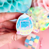 Lula Rocks Digital Aquarium enamel pin, blue teal pink, hand-held angled view