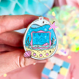 Lula Rocks Digital Aquarium enamel pin, blue pink ocean tamagotchi design, hand-held