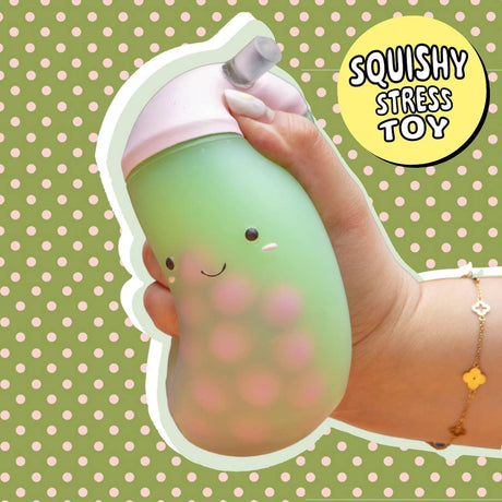 Close up of hand squeezing Matcha Squish-Tea scented boba squishy stress toy