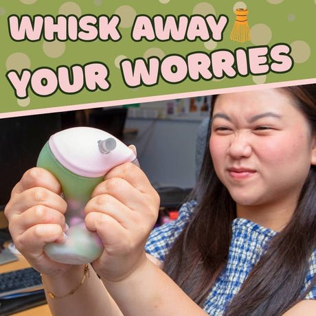Woman squeezing Matcha Squish-Tea boba squishy stress toy with happy reaction