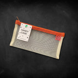 beige mesh pouch with tan zipper and red petta house label organiser