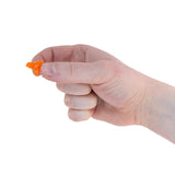 Adult thumb tip holding a tiny orange micro stegosaurus dinosaur fidget